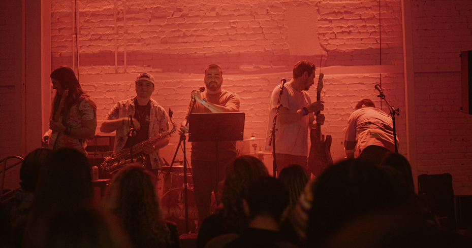 Clayton playing a live show with bandmates